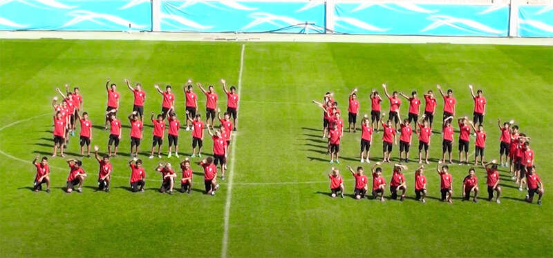 Lokomotiv Tashkent players wave at camera